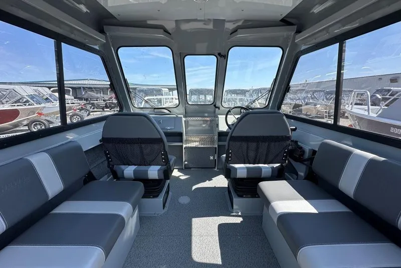 Slide: The Image of Interior of 2025 Hewescraft 200 ProV ET HT boat, featuring seating and helm. - 6