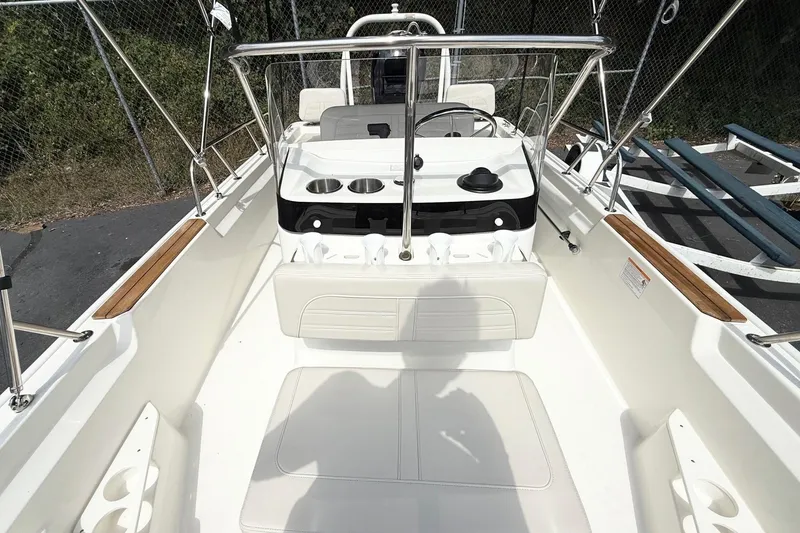 Slide: The Image of 2026 Boston Whaler 170 Montauk boat interior with steering console and seating. - 8