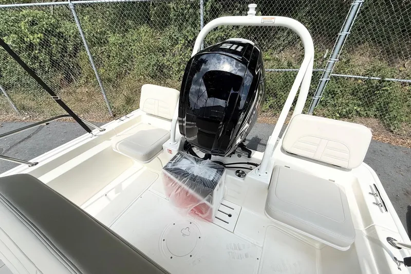 Slide: The Image of 2026 Boston Whaler 170 Montauk boat interior with engine and seating. - 9