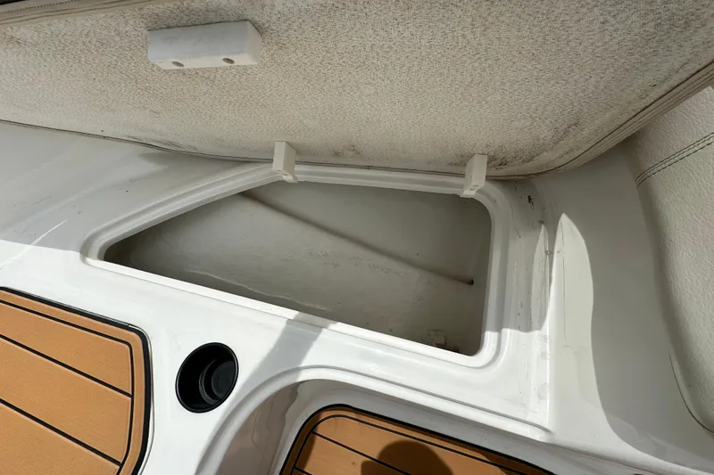 Slide: The Image of 2021 Bayliner Element E18 storage compartment with teak-style flooring. - 7