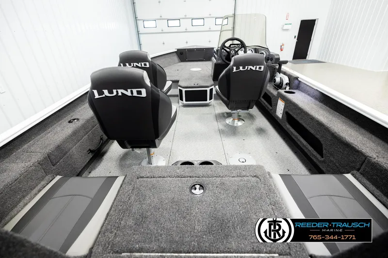 Slide: The Image of 2026 Lund 1775 Adventure SS boat interior with seating and steering console. - 11
