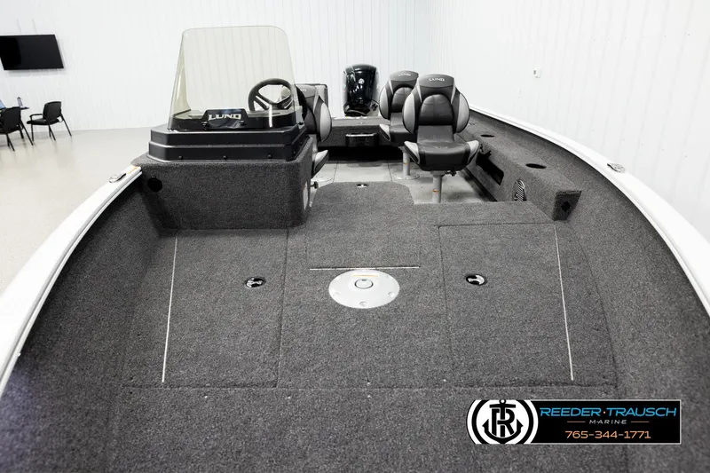 Slide: The Image of 2026 Lund 1775 Adventure SS boat interior with seating and steering console. - 15