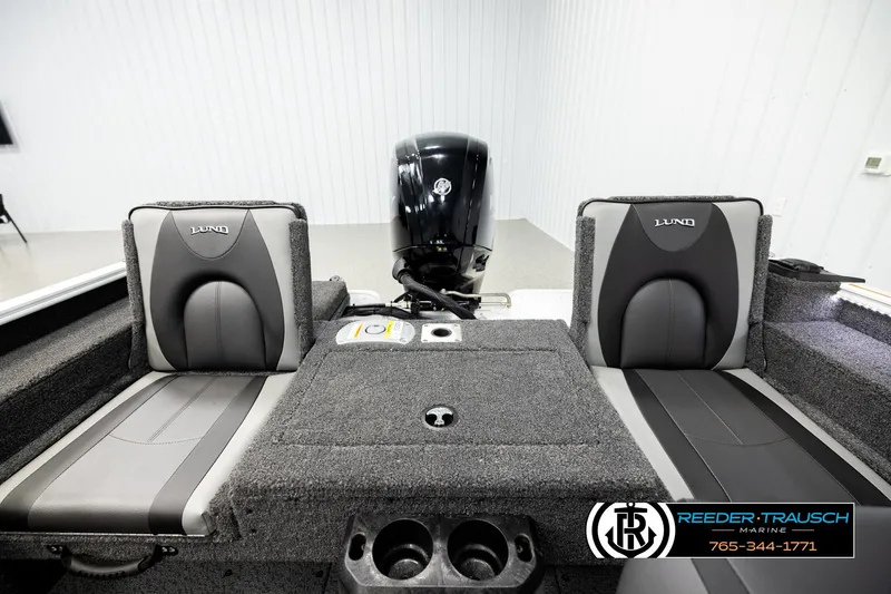 Slide: The Image of 2026 Lund 1775 Adventure SS boat interior with dual seats and motor, showcased by Reeder Trausch Marine. - 17
