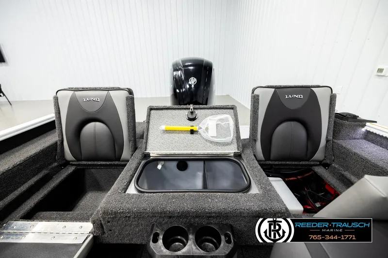 Slide: The Image of 2026 Lund 1775 Adventure SS boat interior with seating and storage compartments. - 18