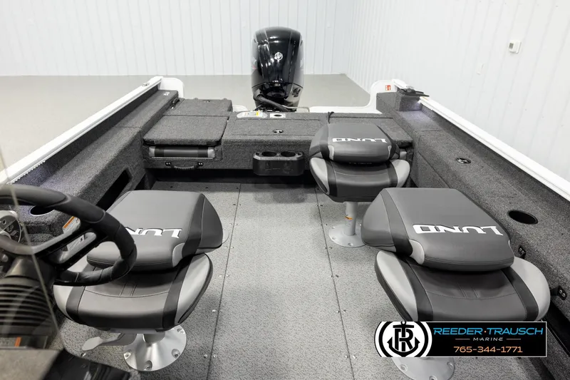 Slide: The Image of 2026 Lund 1775 Adventure SS boat interior with seating and steering wheel. - 20