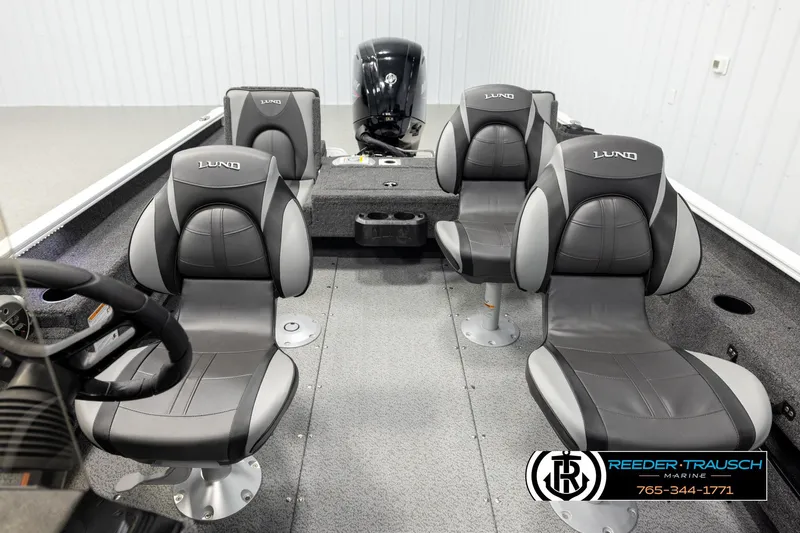 Slide: The Image of 2026 Lund 1775 Adventure SS boat interior with four gray seats and steering console. - 21