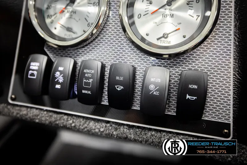 Slide: The Image of Dashboard controls of 2026 Lund 1775 Adventure SS boat with gauges and switches. - 30