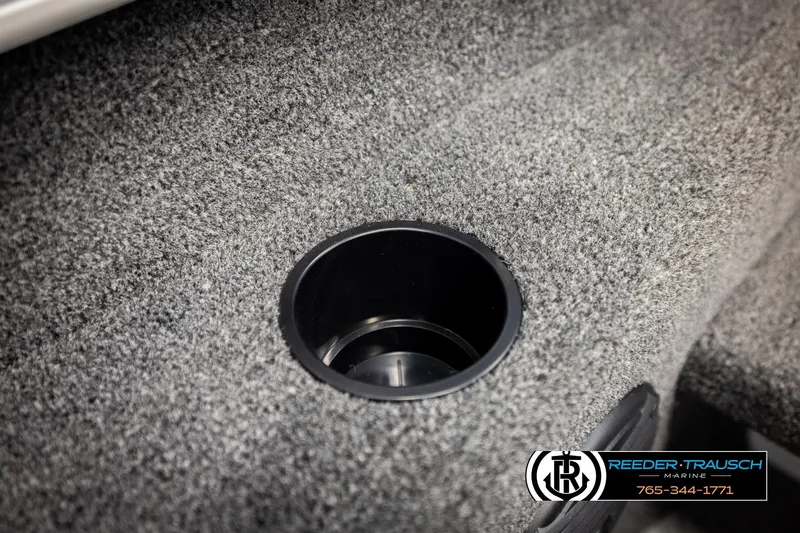 Slide: The Image of 2026 Lund 1775 Adventure SS boat interior with cup holder, gray carpet, Reeder-Trausch Marine logo. - 35