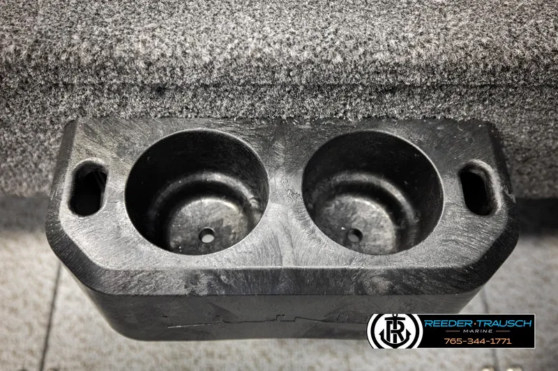 Slide: The Image of Dual cup holder on 2026 Lund 1775 Adventure SS boat, textured surface, Reeder-Trausch Marine logo. - 36
