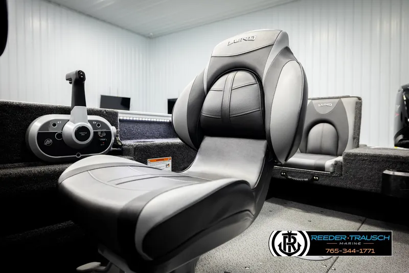Slide: The Image of 2026 Lund 1775 Adventure SS boat interior with sleek seating and control panel. - 37