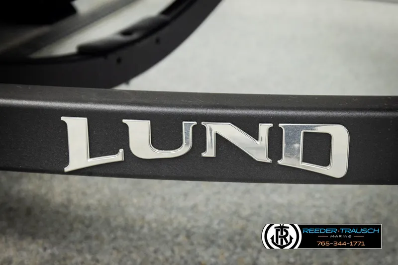 Slide: The Image of Close-up of 2026 Lund 1775 Adventure SS logo on a boat trailer. - 47