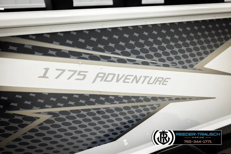 Slide: The Image of 2026 Lund 1775 Adventure SS boat with sleek graphic design and branding. - 49