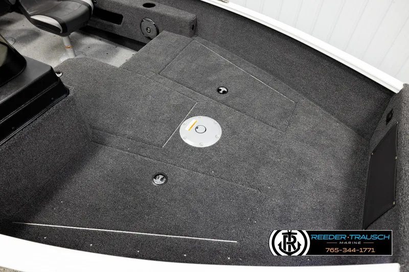 Slide: The Image of 2026 Lund 1775 Adventure SS boat interior with gray carpet and seating. - 7