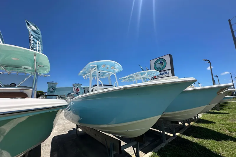 The Image of 2026 Sea Pro 222 Center Console boats displayed outdoors under clear blue sky. - 1