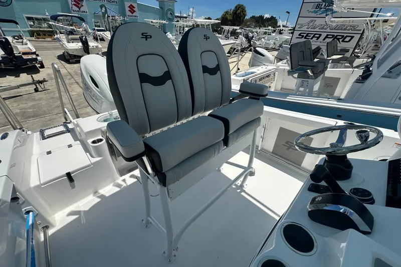 Slide: The Image of 2026 Sea Pro 222 Center Console boat interior with dual seats and steering wheel. - 10