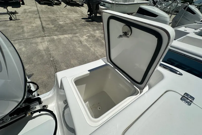 Slide: The Image of 2026 Sea Pro 222 Center Console boat with open storage compartment. - 13