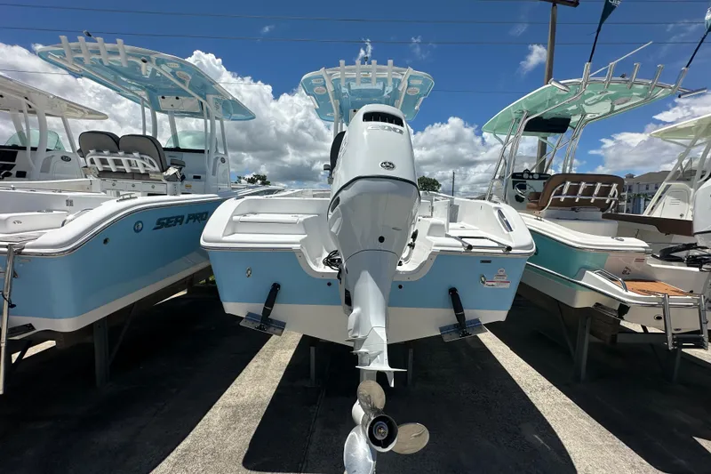 Slide: The Image of 2026 Sea Pro 222 Center Console boat with outboard motor, displayed outdoors. - 3