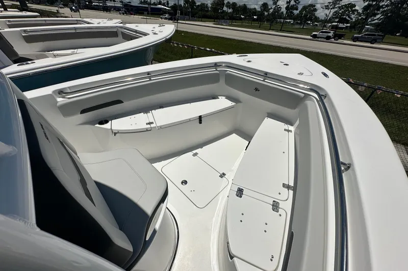 Slide: The Image of 2026 Sea Pro 222 Center Console boat interior with seating and storage compartments. - 5
