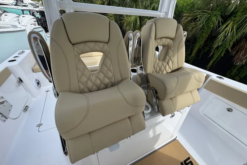 Slide: The Image of 2026 Sportsman Heritage 321 Center Console with luxurious beige seating and modern design. - 10