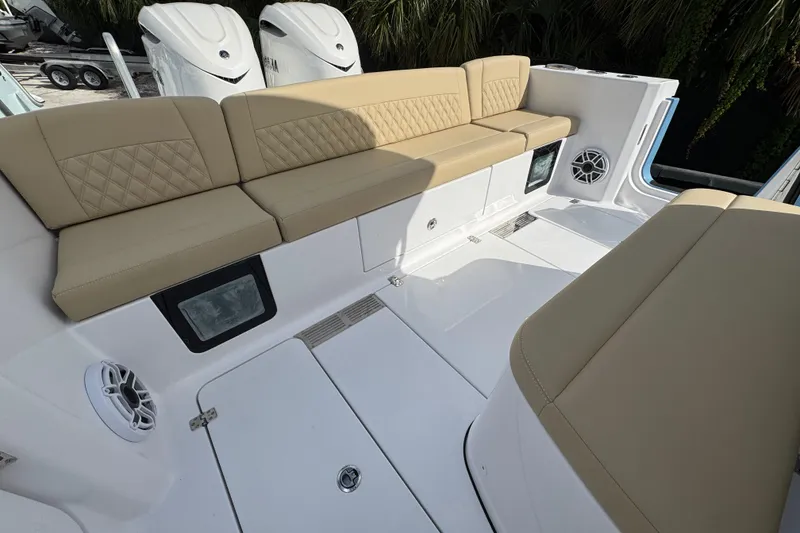 Slide: The Image of 2026 Sportsman Heritage 321 Center Console with beige seating and modern design. - 5