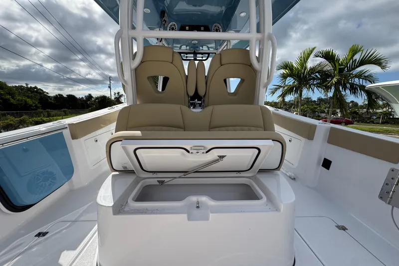 Slide: The Image of 2026 Sportsman Heritage 321 Center Console boat interior with seating and storage. - 7