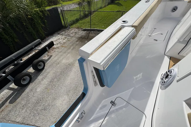 Slide: The Image of 2026 Sportsman Heritage 321 Center Console boat deck with storage and seating. - 8