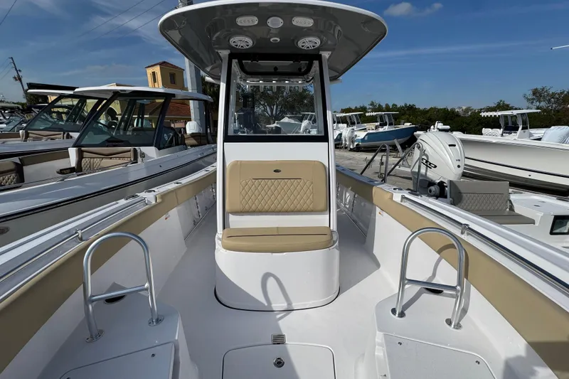 Slide: The Image of 2026 Sportsman Open 232 Center Console boat with seating and modern design. - 13