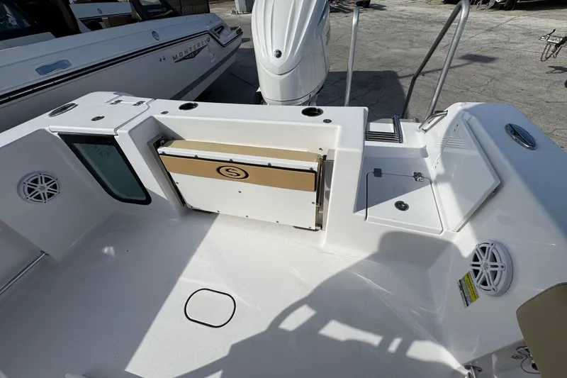 Slide: The Image of 2026 Sportsman Open 232 Center Console boat interior with storage and seating features. - 2
