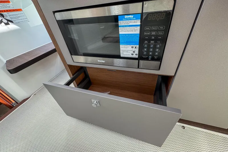 Slide: The Image of Microwave and drawer in 2026 Beneteau Antares 9 boat interior. - 21