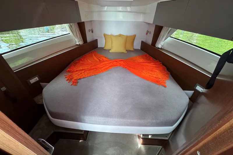 Slide: The Image of Luxurious cabin interior of 2026 Beneteau Antares 9 with cozy bed and vibrant decor. - 22