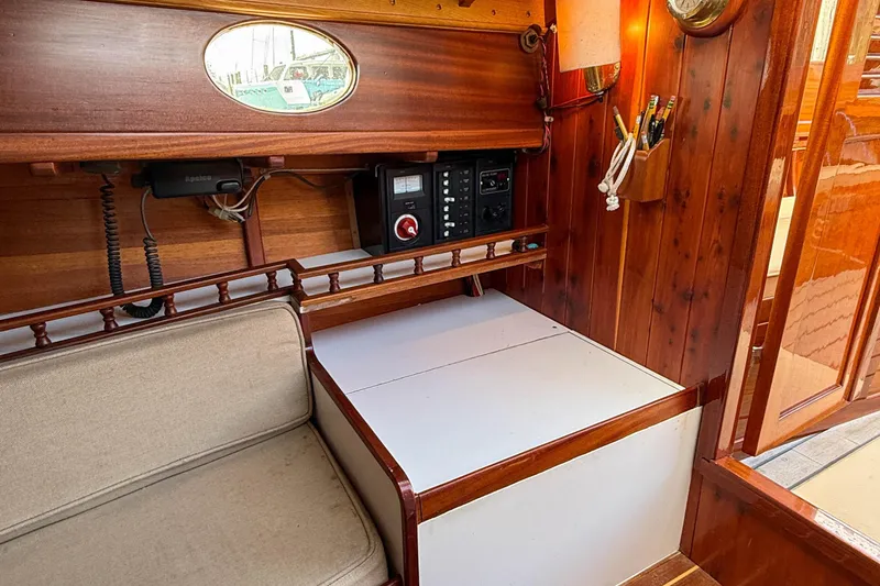 Slide: The Image of Interior of 2012 Herreshoff Custom Hyland Design "Rozinante" with wooden paneling and seating area. - 16