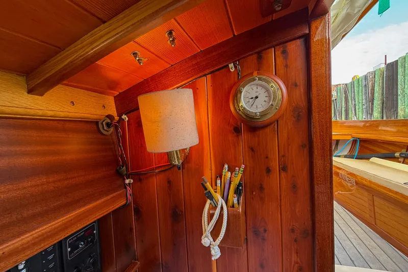 Slide: The Image of Interior of 2012 Herreshoff Custom Hyland Design "Rozinante" with wooden paneling and nautical decor. - 17