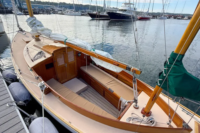 Slide: The Image of 2012 Herreshoff Custom Hyland Design "Rozinante" sailboat docked at marina. - 2