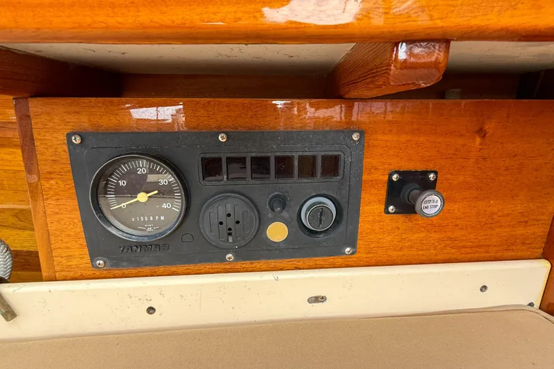 Slide: The Image of Control panel of 2012 Herreshoff Custom Hyland Design "Rozinante" with RPM gauge and engine stop button. - 20
