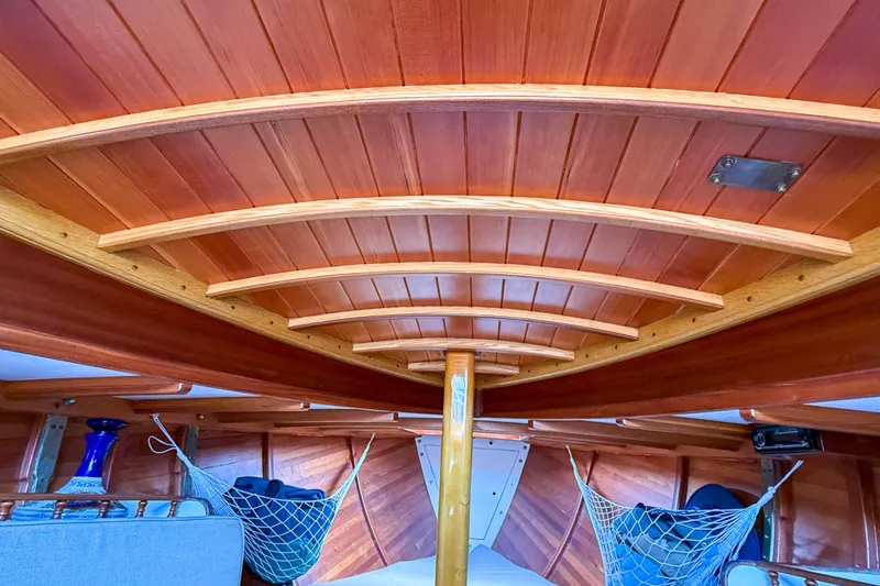 Slide: The Image of Interior of 2012 Herreshoff Custom Hyland Design "Rozinante" with wooden ceiling and net storage. - 22