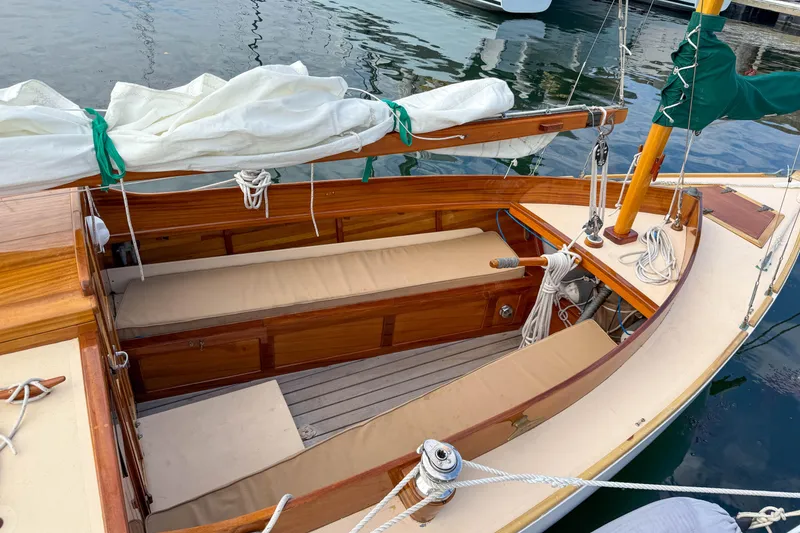 Slide: The Image of 2012 Herreshoff Custom Hyland Design "Rozinante" sailboat with wooden interior and neatly stored sails. - 4