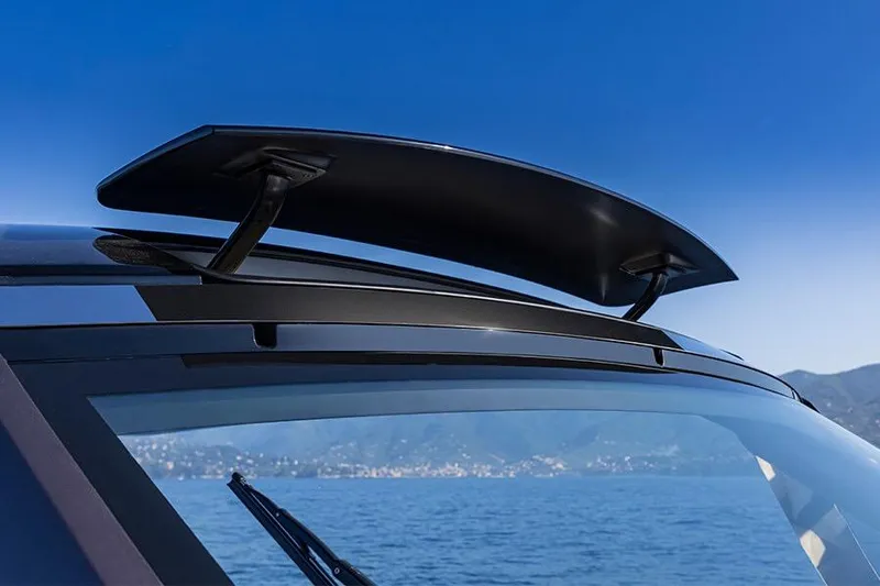 Slide: The Image of 2024 Invictus TT460 boat with sleek roof spoiler, ocean backdrop. - 5