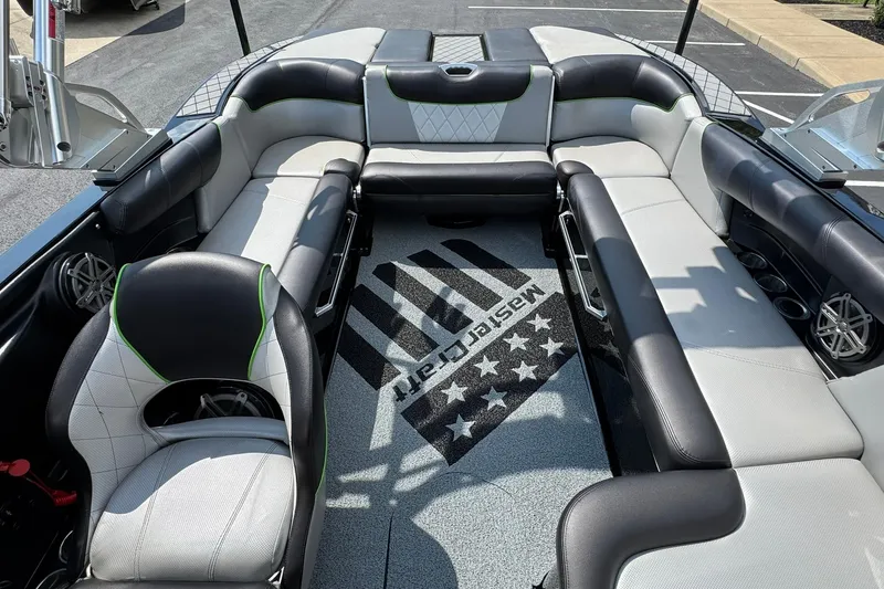 Slide: The Image of 2015 MasterCraft X30 boat interior with stylish seating and branded carpet. - 12