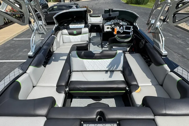 Slide: The Image of 2015 MasterCraft X30 boat interior with luxurious seating and modern dashboard. - 13