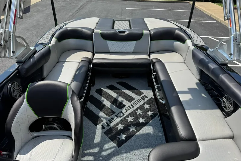 Slide: The Image of 2015 MasterCraft X30 boat interior with stylish seating and branded carpet. - 9