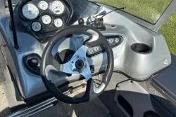 Slide: The Image of 2015 Tracker Targa V-18 Combo boat dashboard with steering wheel and gauges. - 5