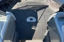 Slide: The Image of 2015 Tracker Targa V-18 Combo boat interior with seating and carpeted floor. - 6