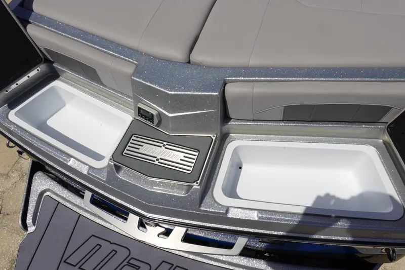 Slide: The Image of 2021 Malibu Wakesetter 25 LSV boat interior with storage compartments and seating. - 10