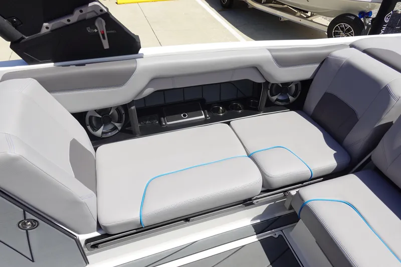 Slide: The Image of 2021 Malibu Wakesetter 25 LSV interior seating with speakers and cup holders. - 13