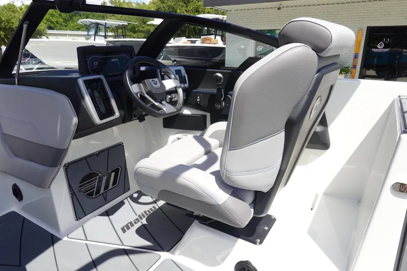 Slide: The Image of 2021 Malibu Wakesetter 25 LSV boat interior with modern dashboard and seating. - 17