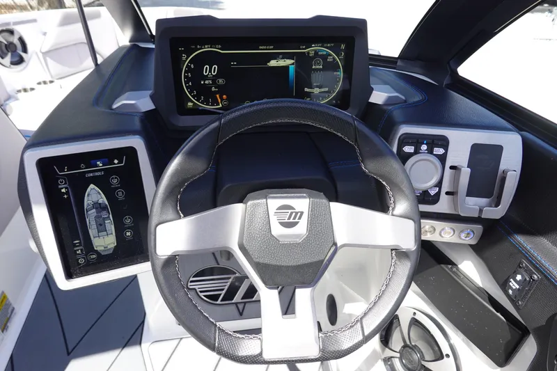 Slide: The Image of 2021 Malibu Wakesetter 25 LSV dashboard with advanced controls and digital displays. - 18