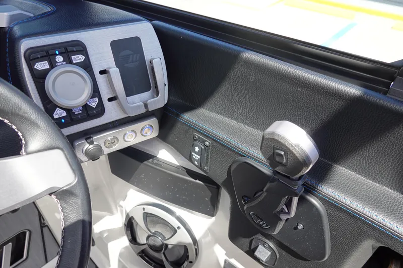 Slide: The Image of 2021 Malibu Wakesetter 25 LSV dashboard with control panel and speaker. - 19