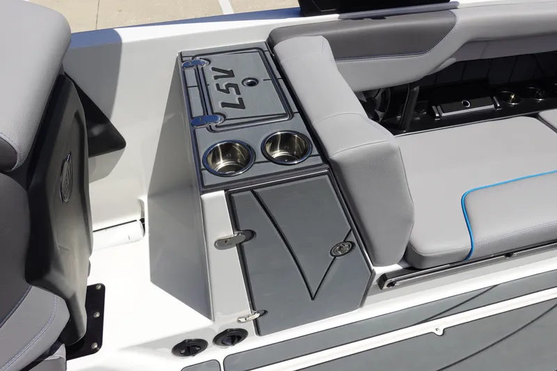 Slide: The Image of 2021 Malibu Wakesetter 25 LSV interior with gray seating and cup holders. - 21