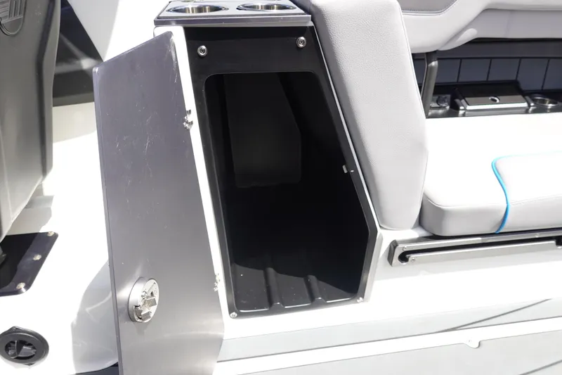 Slide: The Image of Open storage compartment in 2021 Malibu Wakesetter 25 LSV boat interior. - 22