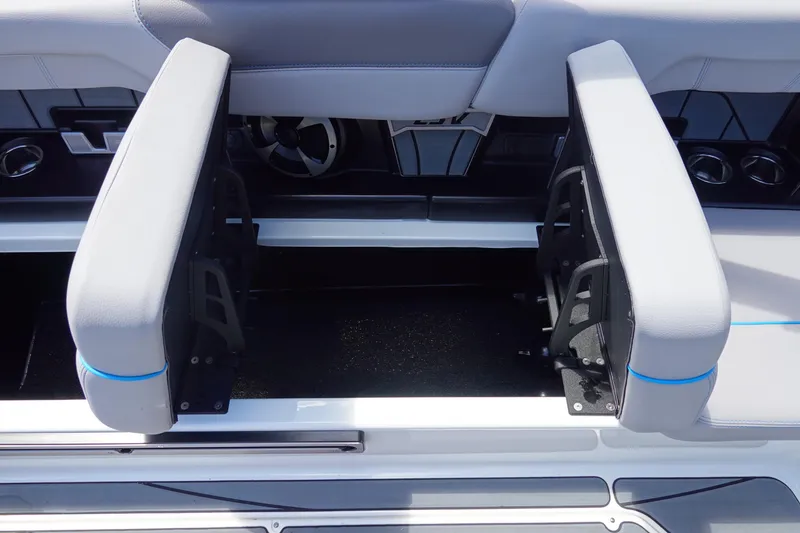 Slide: The Image of 2021 Malibu Wakesetter 25 LSV interior seating with storage compartment. - 26